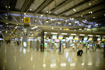 Airport ticket machines and check-in counters (blurred background, defocused)
