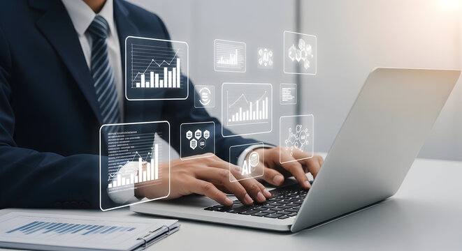 Businessman working on a laptop with financial graphs and analytics in a modern office