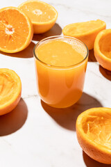 Homemade orange juice with cast shadow isolated on kitchen countertop