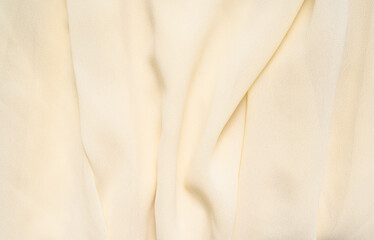 Fototapeta premium Trendy yellow textile background, soft fabric texture in butter color