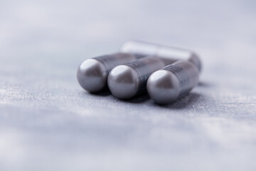 BCAA amino acids tablets. Nutrition for bodybuilding. Fitness supplements on bright background. Soft focus. Copy space.	