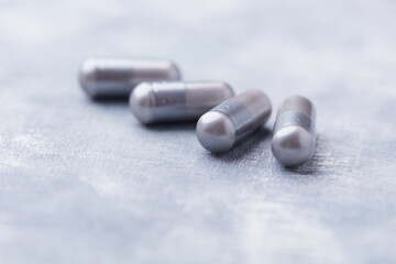 BCAA amino acids tablets. Nutrition for bodybuilding. Fitness supplements on bright background. Soft focus. Copy space.	