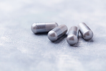 BCAA amino acids tablets. Nutrition for bodybuilding. Fitness supplements on bright background. Soft focus. Copy space.	