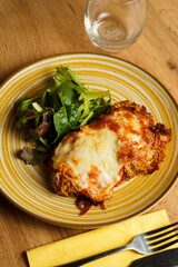 Crispy chicken parmigiana with salad