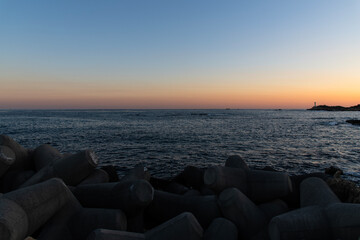 tranquil seascape with tetrapods in dusk