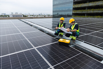 Team technicians and engineers working installing and inspection standards of solar panels on roof...