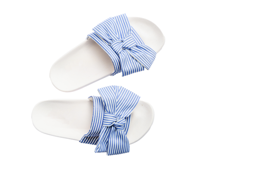 Striped blue and white sandals with bow detail, isolated on white background, top view