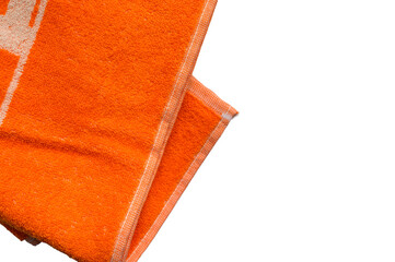 Orange towel on white background, soft bath textile or beach accessory, top view

