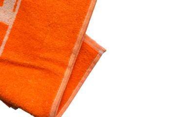 Orange towel on white background, soft bath textile or beach accessory, top view

