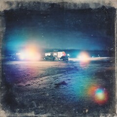 Nighttime Gas Station Scene Under Starry Sky