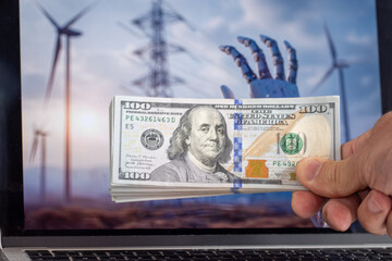 A human hand holding 100 dollar bills with a robotic hand and wind turbines in the background,...