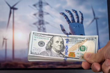 A human hand holding 100 dollar bills with a robotic hand and wind turbines in the background,...