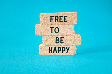 FTBH Free to Be Happy symbol. Concept word Free to Be Happy on beautiful brick blocks. Beautiful...