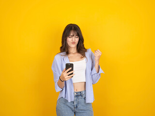 Winner woman concept, portrait of young caucasian winner woman concept photo. Hold use mobile phone...