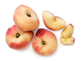 Flat peaches, halves and slices on a white background. Top view