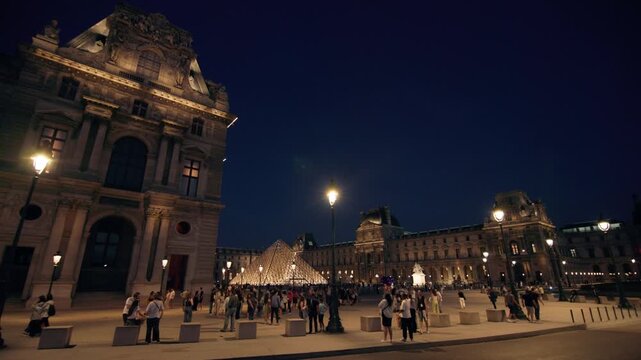 Night urban landscape of Paris with illuminated historical streets in the capital of France showing romantic city atmosphere popular for tourism and European travel