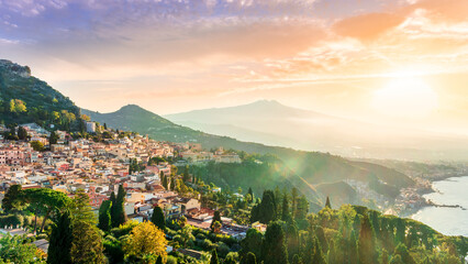 panoramic view of beautiful sunset in old european town with vintage buildings and great mountains...