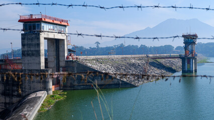 landscape photo of dam building for power plant in a village