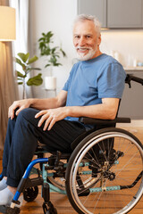Senior man smiling sitting on wheelchair in living room