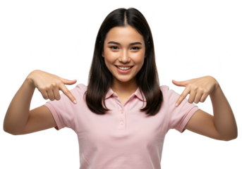 A happy young asian woman smiles and points down with both hands, isolated on transparent background