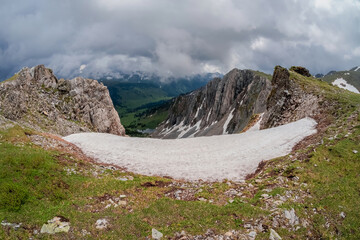 Snow dome and colorful rocky peaked top