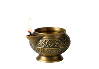 An ornate brass oil lamp with a burning flame, isolated on a transparent background
