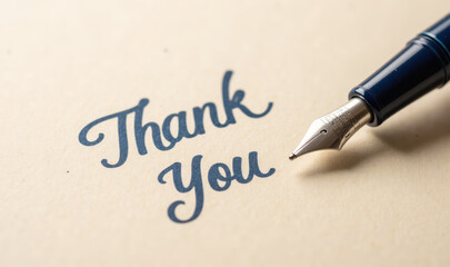Thank you note with elegant pen, expressing gratitude and appreciation. fine details of pen and script create warm, inviting atmosphere
