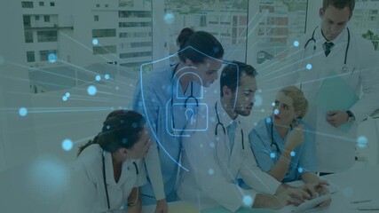 Leaning forward on tablet, medical team reviewing data with nodes forming shield for security - Powered by Adobe