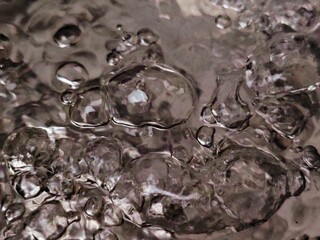 Abstract CloseUp of Bubbles in Water Reflective Surface Monochrome Tones.