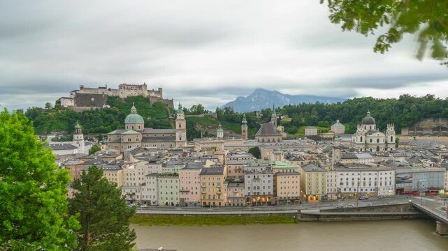The city of Salzburg with the Salzach River and the Fortess Hochenzalzburg, Austria - Timelapse Video