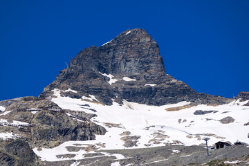 Mountain landscape at L&ouml;tschental Valley with rock and Hockenhorn mountain peak in the Swiss Alps on a sunny late spring day. Photo taken June 19th, 2025, L&ouml;tschental, Switzerland.