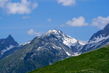 Fototapeta premium Mountain landscape at Lötschental Valley with rock and mountain peak in the Swiss Alps on a sunny late spring day. Photo taken June 19th, 2025, Lötschental, Switzerland.