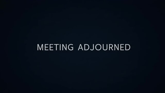 Meeting Adjourned A formal announcement signaling the end of a business meeting in a dark setting