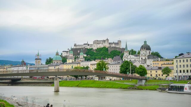 The city of Salzburg with the Salzach River and the Fortess Hochenzalzburg, Austria - Timelapse Video