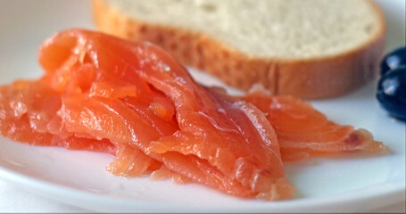 Appetizing Smoked Salmon Fillet, Rustic Bread, and Black Olives for a Healthy Meal