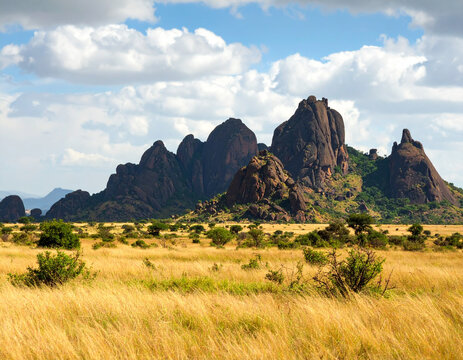 The Black Rocks of Pungo Andongo, imposing and mysterious geological formations, rising from a flat, savanna landscape.