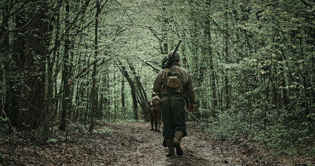 Soldier Walking on a Forest Path in Full Military Gear