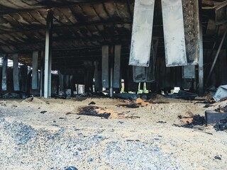 A destroyed building's interior reveals the devastating effects of a fire and its aftermath.