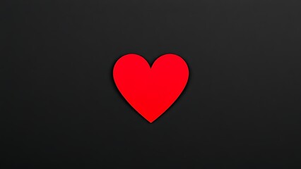 Minimalist red heart on dark textured background with directional lighting