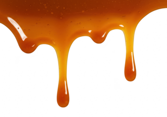 Golden caramel sauce is slowly dripping down, creating a smooth texture, isolated on white isolated on transparent background