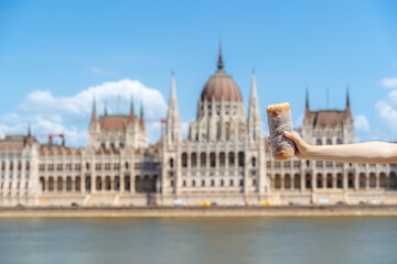 Fototapeta premium Chimney cake and Parliament of Budapest