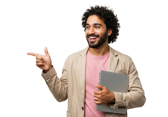A happy man with curly hair points to the left while holding a laptop, isolated on a transparent background
