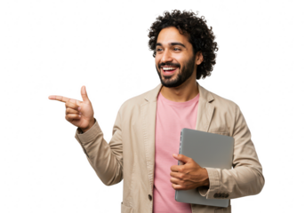 A happy man with curly hair points to the left while holding a laptop, isolated on a transparent background