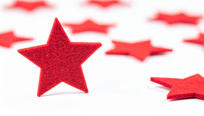Obraz premium Red felt star shape isolated on white backdrop.