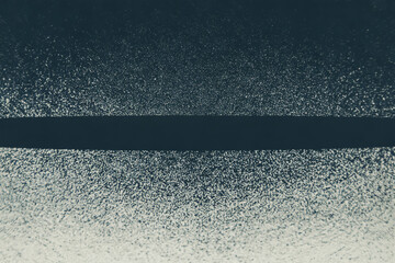Dark band on speckled background abstract texture