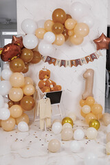 Birthday celebration setup featuring balloons and decorations for a first birthday party