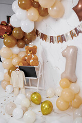 Celebration setup for a first birthday party featuring balloons and decorations