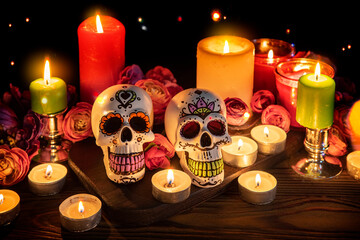 Skulls with decor for the holiday Day of the Dead. Dia de los Muertos altar surrounded by...