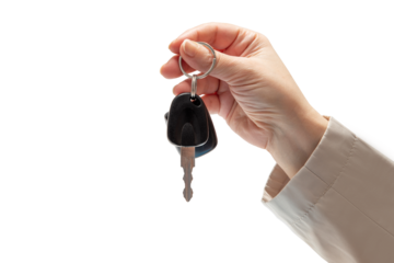 Hand holding car keys on isolated background. Concept of selling or renting a car