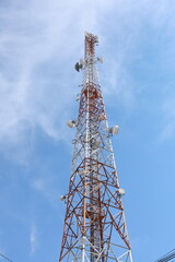 Cell phone tower with an antenna for mobile telecommunication and wireless network technology in the blue sky